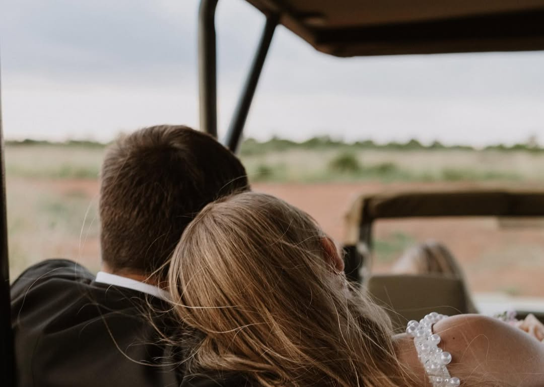 Couple enjoying a Tanzania vow renewal experience combining safari adventure and Zanzibar beach romance