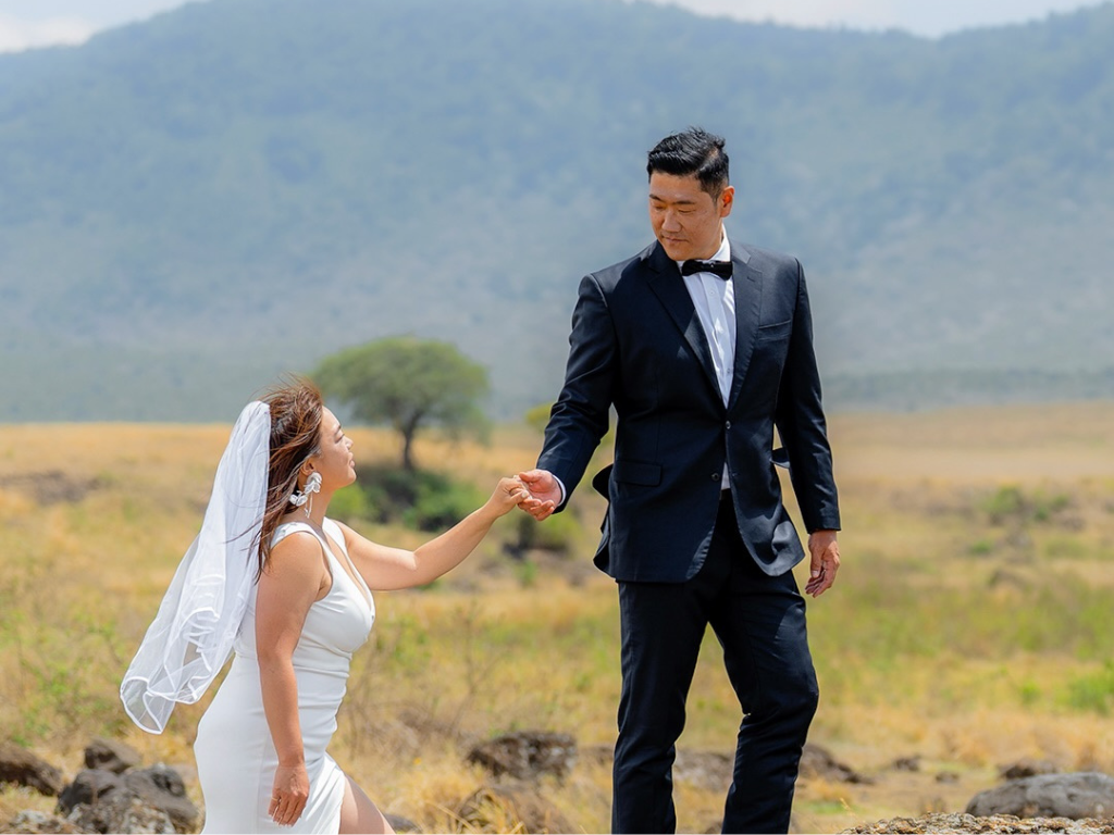 Wedding couple at Ngorongoro Crater Tanzania during dry season — the best time for a Ngorongoro destination wedding