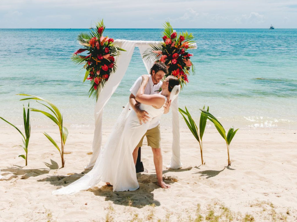 Bride and groom enjoying a multi-day Tanzania destination wedding package with safari and beach experiences.