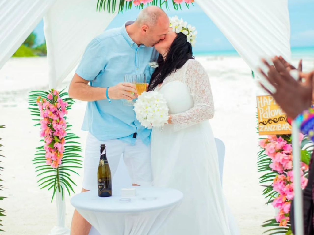 Bride and groom exchanging vows during an exclusive, private sandbank elopement ceremony in Zanzibar with Cube Nation Tanzania.