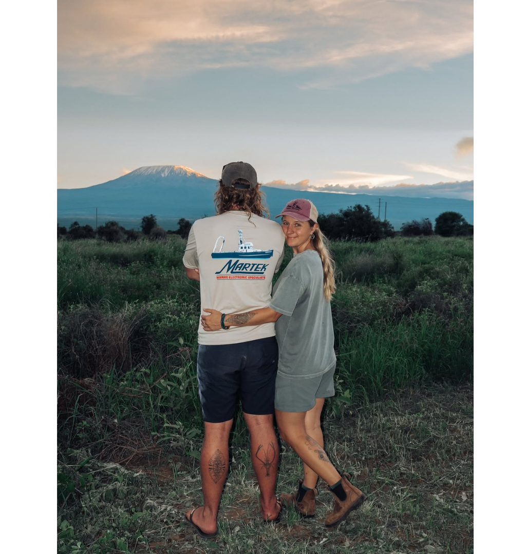 A couple enjoying a private luxury sundowner safari tour in Tanzania for Valentine's Day.