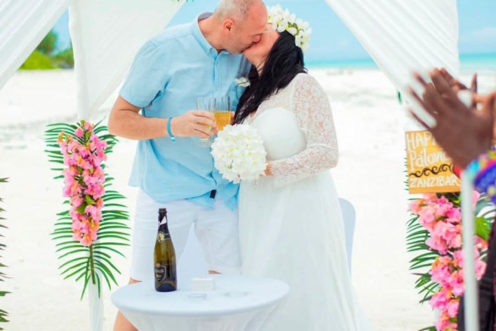 Bride and groom exchanging vows during an exclusive, private sandbank elopement ceremony in Zanzibar with Cube Nation Tanzania.
