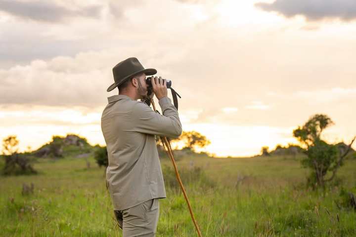 Panoramic view of the Ngorongoro Crater floor taken from an open-roof luxury safari vehicle during a romantic honeymoon trip.